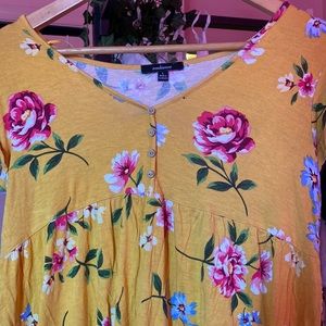 Yellow shirt with pink & blue & yellow flowers with green leafs